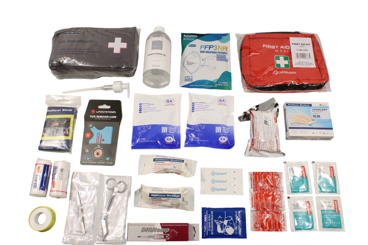 STS Erste Hilfe Plus, kompletter Set-Inhalt: Beatmungsfolie Quick Breezer, Digitemp Fieberthermometer, drei Burnshield Gel Sachets, vakuumverpackter Trauma-Wundverband, zwei Fixierbinden, Splitterpinzette, zwei Verbandpäckchen, Verbandschere nach Lister, Wundpflaster und Ypsiplast Heftpflaster